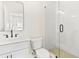 Modern bathroom includes a glass-enclosed shower, sleek fixtures, and a white vanity for a clean aesthetic at 235 Briscoe Way # 7, Alpharetta, GA 30009