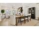 Spacious open-plan dining room with a fireplace, hardwood floors and open to living room at 235 Briscoe Way # 7, Alpharetta, GA 30009