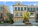Charming two-story townhome with brick facade, second story balcony, and a two car garage at 235 Briscoe Way # 7, Alpharetta, GA 30009
