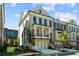 Beautiful brick townhome with a metal roof, second story balcony, and a two car garage at 235 Briscoe Way # 7, Alpharetta, GA 30009