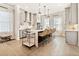 A bright kitchen with an island, white countertops, pendant lights, and modern appliances at 235 Briscoe Way # 7, Alpharetta, GA 30009