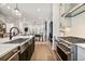 Modern kitchen featuring stainless steel appliances, a farmhouse sink, and an open floor plan at 235 Briscoe Way # 7, Alpharetta, GA 30009