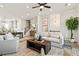 Spacious living room that transitions to the dining and kitchen areas, creating an open and inviting space at 235 Briscoe Way # 7, Alpharetta, GA 30009