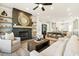 Open concept living room, dining room, and kitchen with hardwood floors and neutral-toned furniture at 235 Briscoe Way # 7, Alpharetta, GA 30009