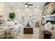 Bright living room with a fireplace, large windows, neutral tones, and comfortable seating at 235 Briscoe Way # 7, Alpharetta, GA 30009