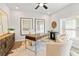 Well-lit home office boasts a large desk, comfortable seating, and stylish decor creating an inviting workspace at 235 Briscoe Way # 7, Alpharetta, GA 30009
