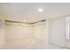 Unfinished basement providing potential for customization, featuring white walls and exposed ceiling elements at 2949 Pearl St, East Point, GA 30344