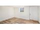 Spacious basement showcasing new flooring, a utility door, and a bright, clean aesthetic at 2949 Pearl St, East Point, GA 30344