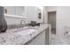 Bright bathroom featuring granite countertops, dual sinks, and modern fixtures at 2949 Pearl St, East Point, GA 30344