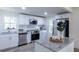 Modern kitchen with stainless steel appliances, granite countertops, and white cabinetry at 2949 Pearl St, East Point, GA 30344