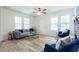 Bright living room featuring modern decor, ample natural light, and hardwood floors at 2949 Pearl St, East Point, GA 30344