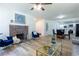 Bright living room featuring a brick fireplace, hardwood floors, and an open floor plan at 2949 Pearl St, East Point, GA 30344