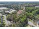 Aerial view of home in a wooded, residential neighborhood at 4900 College St, Union City, GA 30291