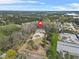 Aerial view of the home and neighborhood, set amongst mature trees and lush landscaping at 4900 College St, Union City, GA 30291