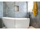 Modern bathroom showcasing a freestanding tub, stylish tile work, and contemporary fixtures at 4900 College St, Union City, GA 30291