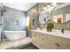 Stylish bathroom with a free-standing tub, walk-in shower, double vanity, and modern finishes at 4900 College St, Union City, GA 30291