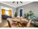 Cozy dining room with modern decor, a round table and a view into the living room at 4900 College St, Union City, GA 30291