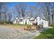 Beautiful home with a brick wall, manicured lawn, and charming architecture at 4900 College St, Union City, GA 30291