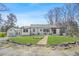 Charming single-story home with a well-manicured lawn, brick walkway and inviting curb appeal at 4900 College St, Union City, GA 30291