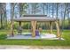 Elegant gazebo with draped curtains and outdoor seating, perfect for relaxing or entertaining at 4900 College St, Union City, GA 30291