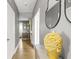 Inviting hallway with a decorative vase and mirror, leading to other rooms at 4900 College St, Union City, GA 30291