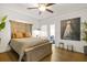 A well-lit main bedroom with hardwood floors and decorative artwork, creating a calming retreat at 4900 College St, Union City, GA 30291