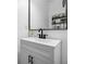 Modern bathroom vanity with sleek hardware and decorative shelving at 5860 Bluff Heights Drive, Cumming, GA 30040