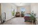 Bedroom area features a small bed and access to the balcony at 5860 Bluff Heights Drive, Cumming, GA 30040
