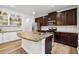 Kitchen showcasing granite counters, stainless appliances, and hardwood floors at 5860 Bluff Heights Drive, Cumming, GA 30040