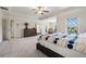 Spacious main bedroom features a large bed, a dresser, and balcony access at 5860 Bluff Heights Drive, Cumming, GA 30040