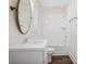 Cozy bathroom with a white vanity, stylish mirror, and a tub with white subway tile at 1011 Stillington Way, Kennesaw, GA 30152