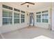 Covered outdoor patio with many windows at 1011 Stillington Way, Kennesaw, GA 30152