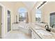 Bathroom featuring dual sinks, granite counters, jacuzzi tub and large window with natural light at 1811 Lake Cove Sw Dr, Atlanta, GA 30331