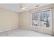 Bedroom with a ceiling fan and large window for natural light and views at 1811 Lake Cove Sw Dr, Atlanta, GA 30331
