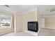 Corner bedroom with a fireplace, large window for natural light, and neutral colored walls and carpet at 1811 Lake Cove Sw Dr, Atlanta, GA 30331