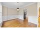 Formal dining room with hardwood floors, elegant lighting, and wainscoting at 1811 Lake Cove Sw Dr, Atlanta, GA 30331