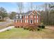 Charming brick home featuring a well-manicured lawn and classic architectural details at 1811 Lake Cove Sw Dr, Atlanta, GA 30331