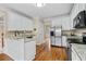 Kitchen featuring stainless steel appliances, granite countertops and adjacent to dining area at 1811 Lake Cove Sw Dr, Atlanta, GA 30331