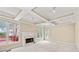 Bright and spacious living room featuring a fireplace and coffered ceilings at 1811 Lake Cove Sw Dr, Atlanta, GA 30331