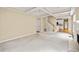 Spacious living room featuring a fireplace and staircase to the upper level at 1811 Lake Cove Sw Dr, Atlanta, GA 30331