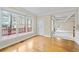 Bright living room with hardwood floors, large windows, and view of the deck at 1811 Lake Cove Sw Dr, Atlanta, GA 30331
