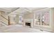 Bright and spacious living room featuring a fireplace, coffered ceilings, and large windows at 1811 Lake Cove Sw Dr, Atlanta, GA 30331