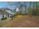 Large, private backyard featuring a patio with seating, landscaping, and a privacy fence at 2770 Da Vinci Cres, Decatur, GA 30034