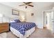 Bedroom features a ceiling fan and an adjacent doorway with a peek into the hall at 2770 Da Vinci Cres, Decatur, GA 30034