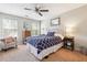 Bright bedroom with a ceiling fan, natural light, and calming neutral tones at 2770 Da Vinci Cres, Decatur, GA 30034