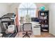 Bonus room with a large arched window, a desk, and some exercise equipment at 2770 Da Vinci Cres, Decatur, GA 30034