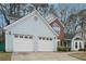 Charming home featuring a two-car garage, light blue siding, and brick accents at 2770 Da Vinci Cres, Decatur, GA 30034