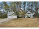 Beautiful home with a two-car garage, blue siding and lush front lawn at 2770 Da Vinci Cres, Decatur, GA 30034