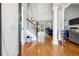 Bright foyer featuring hardwood floors, staircase, and an open view into the living area at 2770 Da Vinci Cres, Decatur, GA 30034