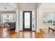 Elegant foyer with hardwood floors, white columns, and a view into the living room at 2770 Da Vinci Cres, Decatur, GA 30034